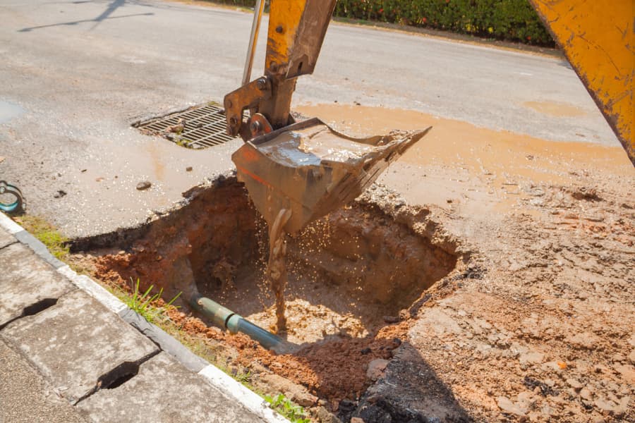 An excavator uncovers a sewer line in New Jersey