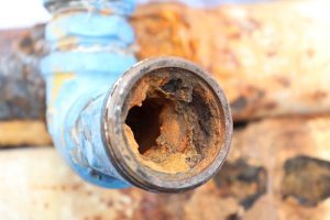Red rust inside a corroded pipe