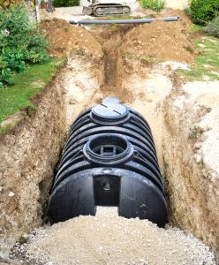 Septic tank in hole in yard